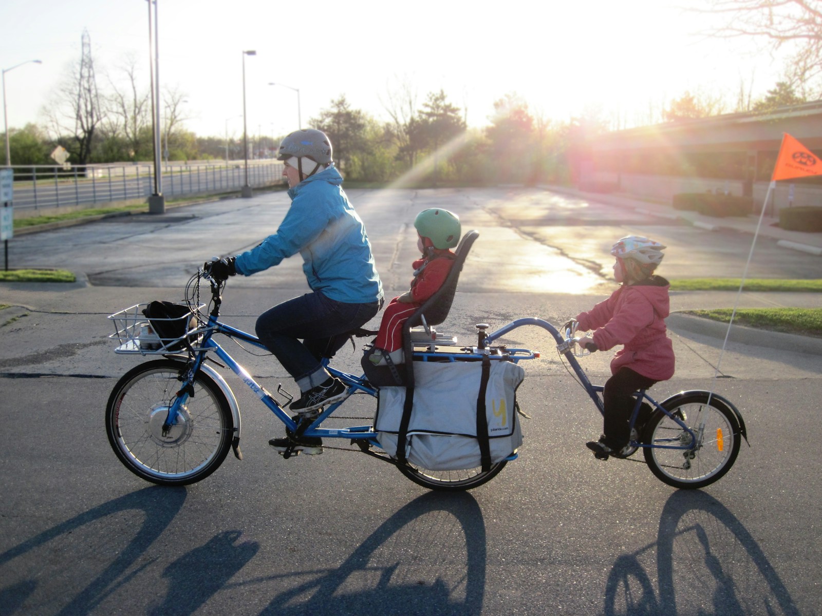 2 men riding on bicycle during daytime